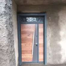 wood coated exterior door with long handle